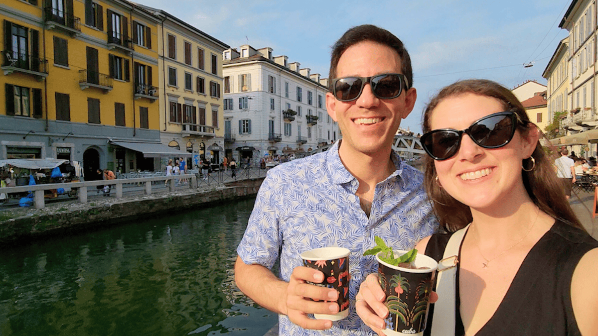 sam and chris in milan, italy near canal with drinks